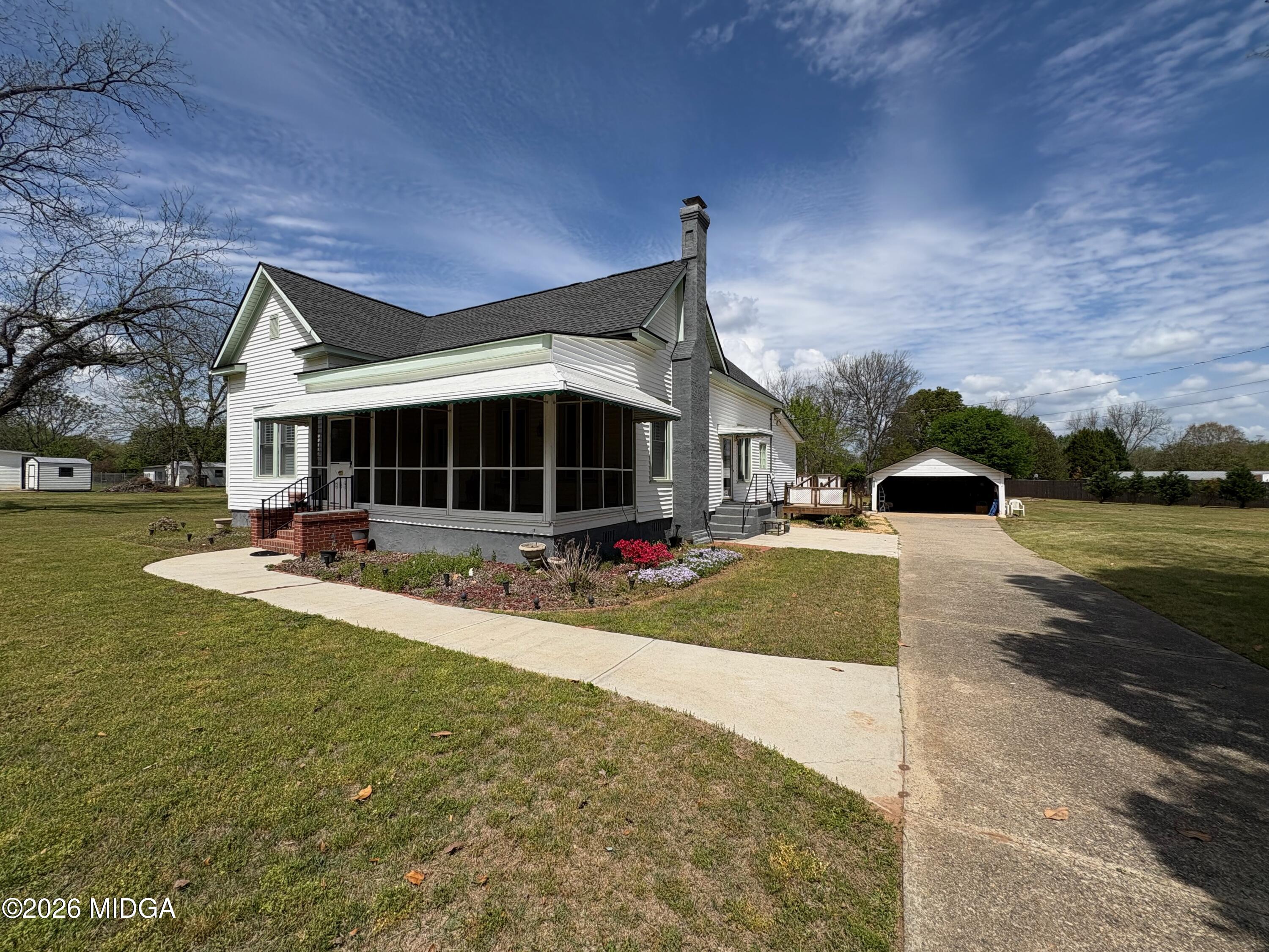 a view of a house with a yard