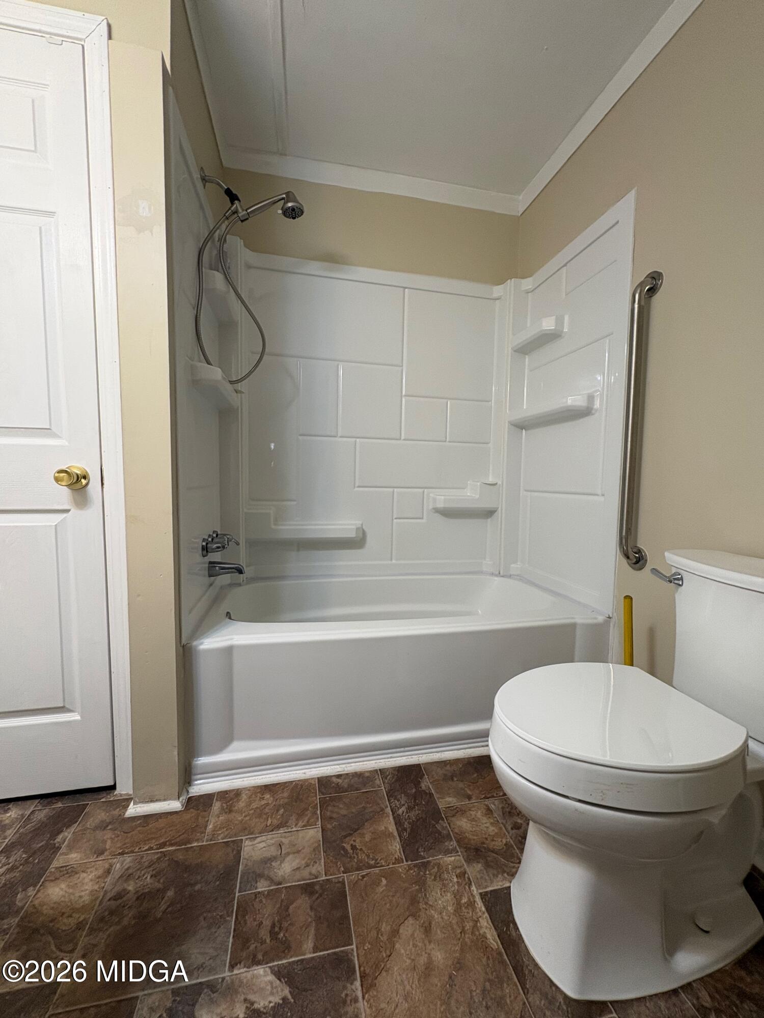 205 White Road Byron, GA 31008 - Photo 22 of 38 a bathroom with a toilet and a shower