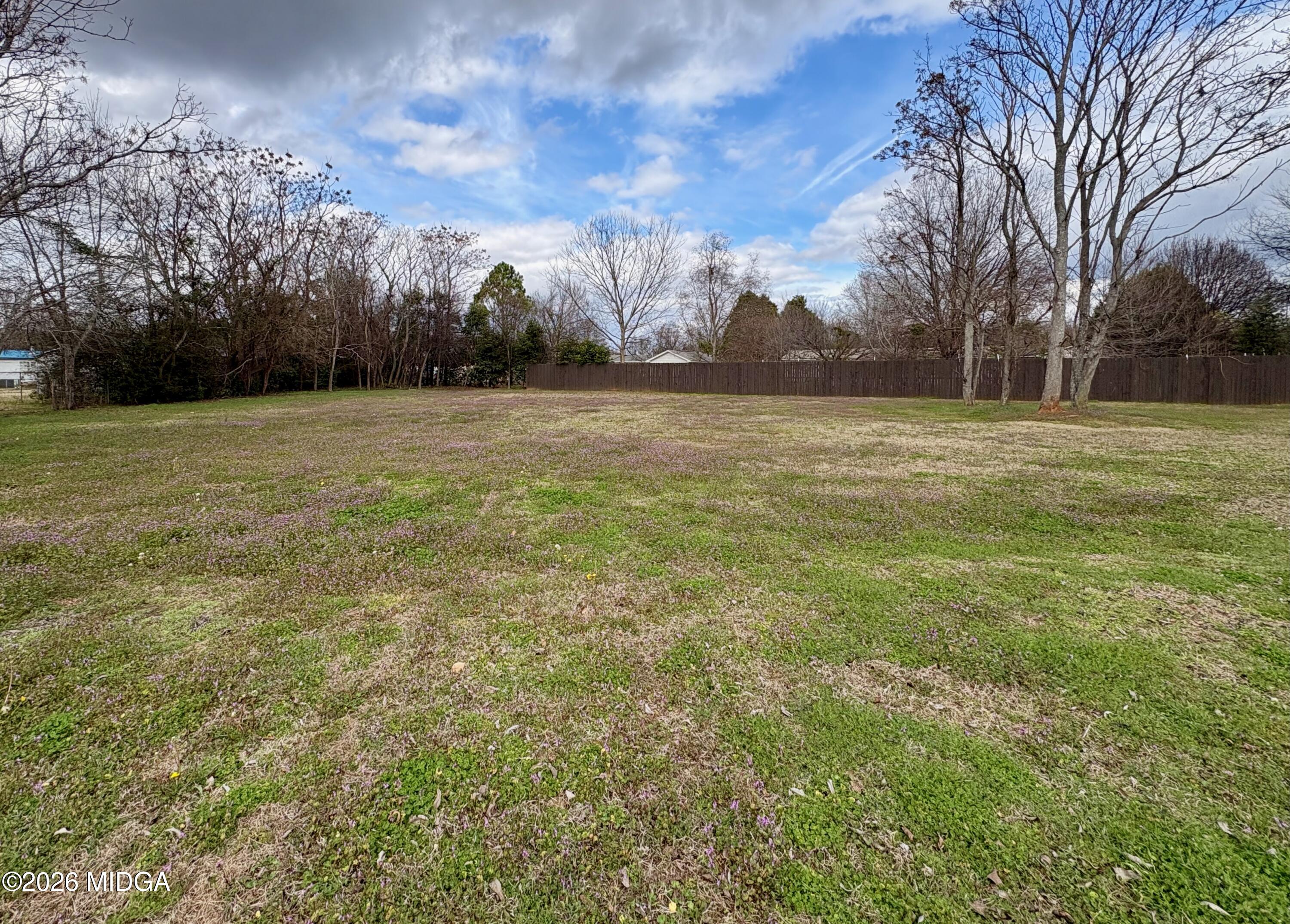 205 White Road Byron, GA 31008 - Photo 23 of 38 a view of a field of grass and trees