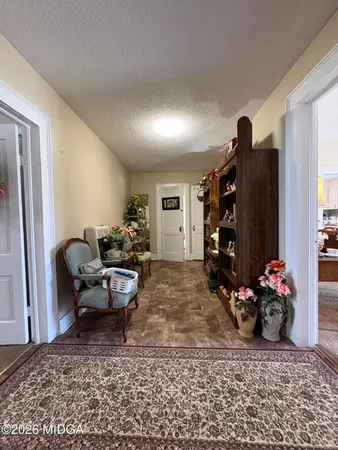 a kitchen with granite countertop sink stove and cabinets