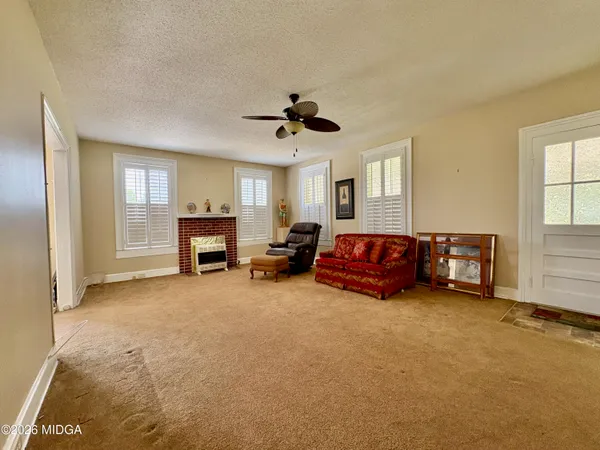 a bedroom with windows