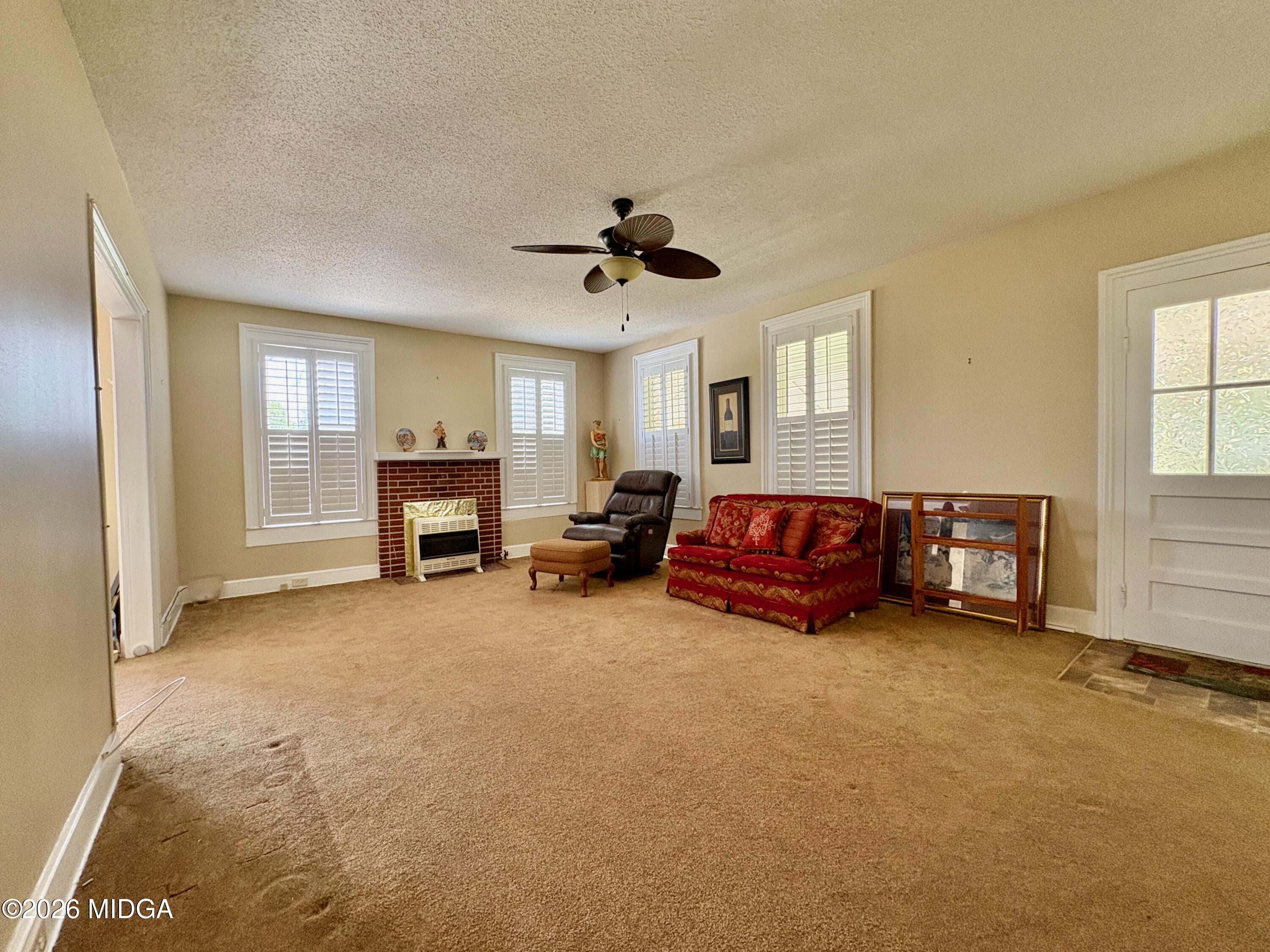 205 White Road Byron, GA 31008 - Photo 4 of 38 a living room with furniture and a ceiling fan