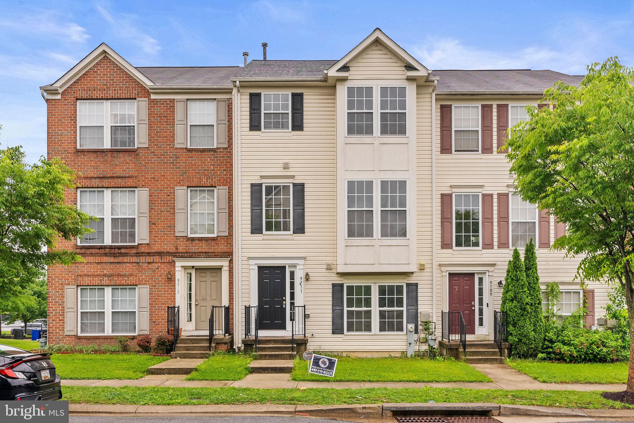 9711 Luguna Road Baltimore, MD 21220 - Photo 1 of 37 a front view of a house with a yard