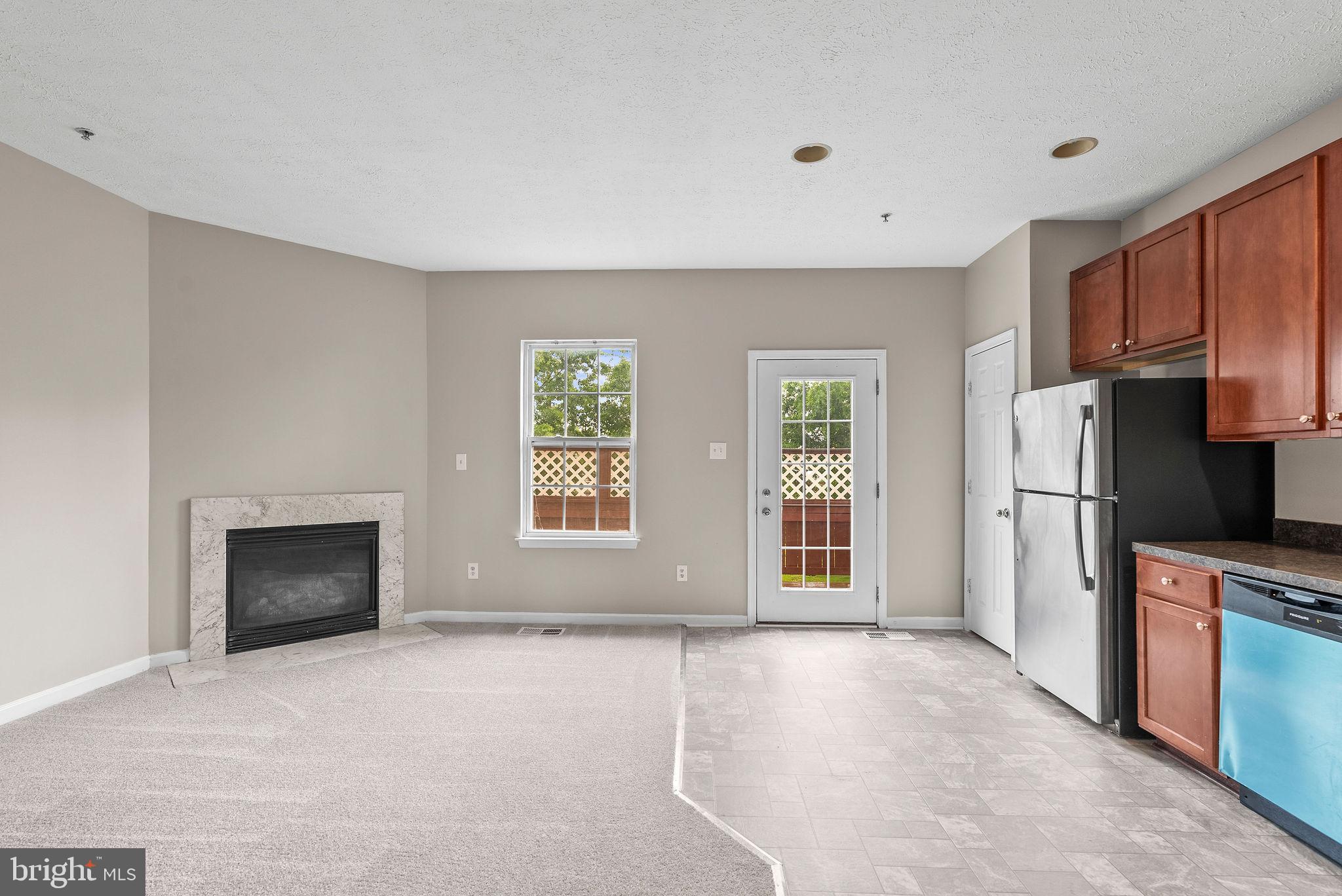 9711 Luguna Road Baltimore, MD 21220 - Photo 15 of 37 a view of a kitchen with a sink and a fireplace