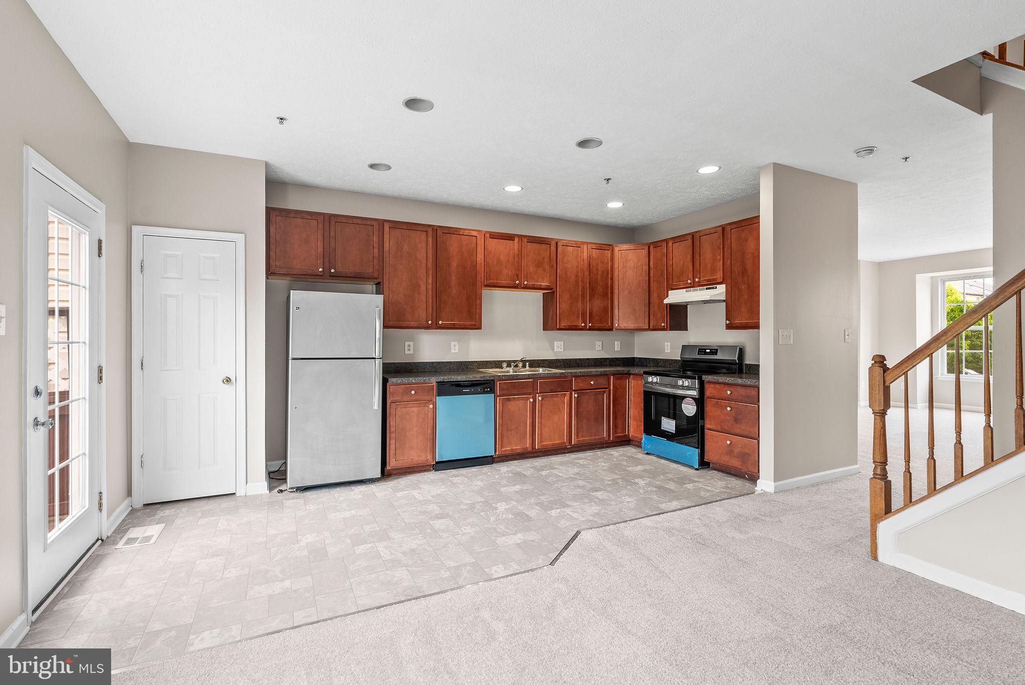 9711 Luguna Road Baltimore, MD 21220 - Photo 19 of 37 a kitchen with stainless steel appliances granite countertop a refrigerator and a stove top oven