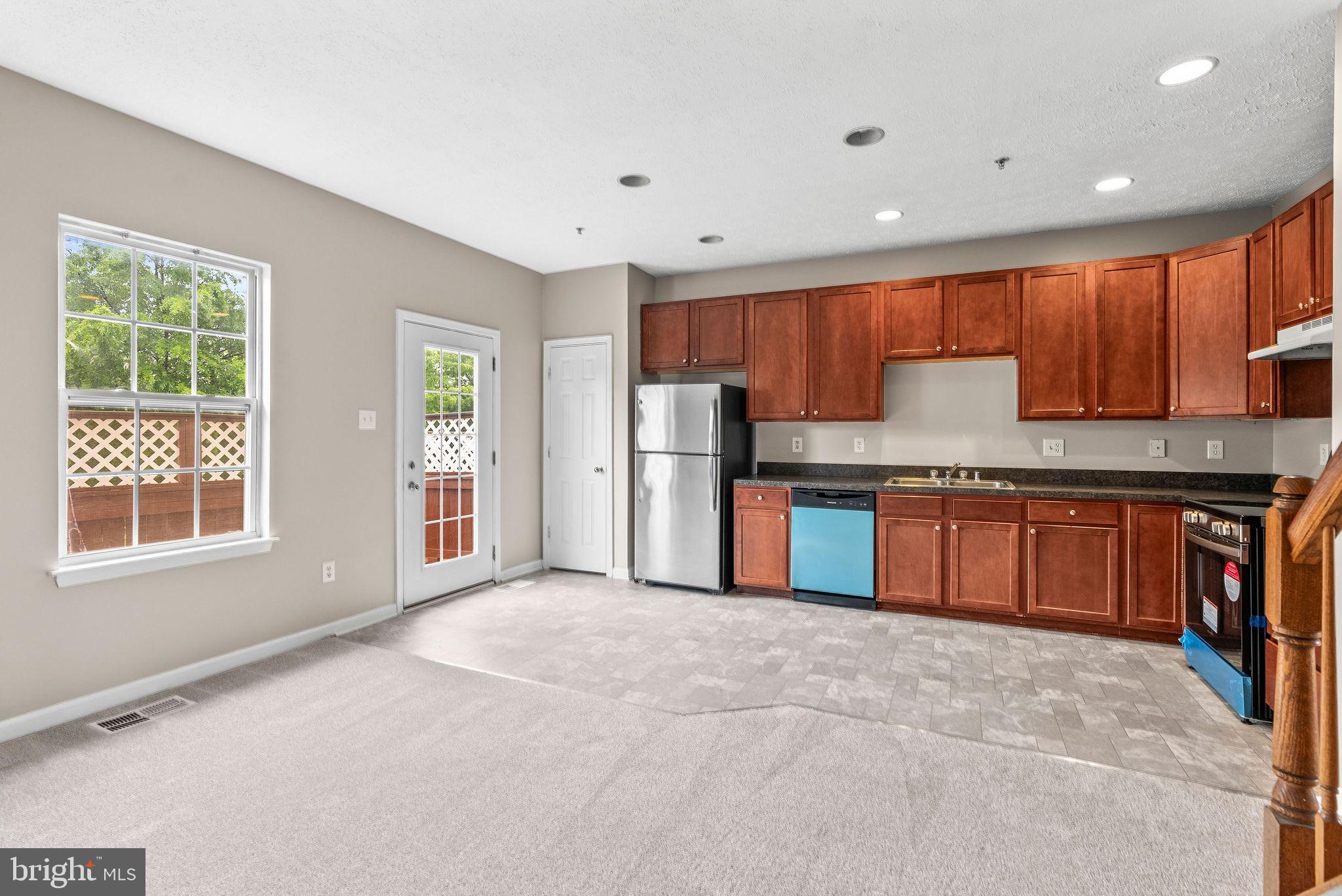 9711 Luguna Road Baltimore, MD 21220 - Photo 20 of 37 a kitchen with stainless steel appliances granite countertop a refrigerator and a stove top oven