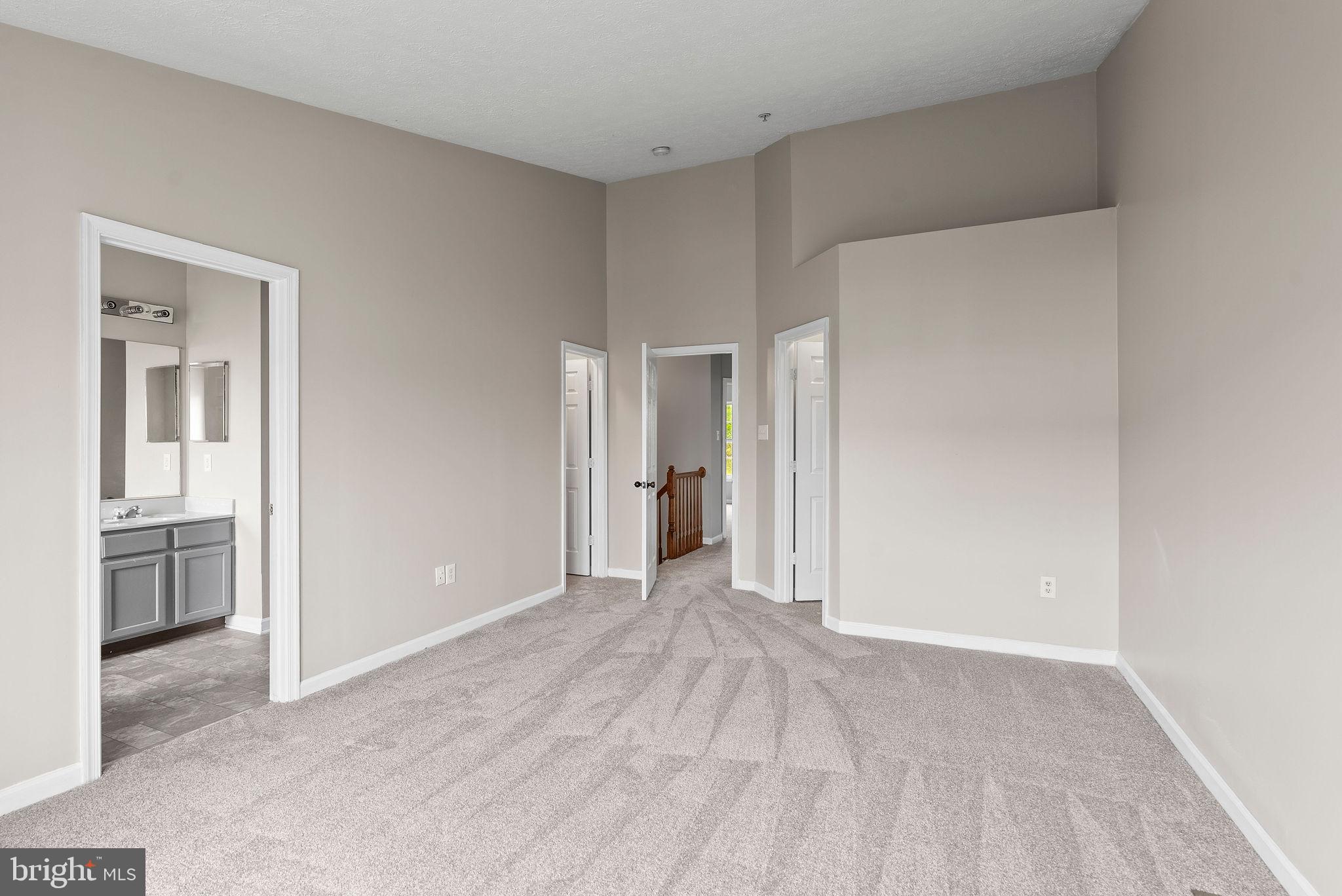 9711 Luguna Road Baltimore, MD 21220 - Photo 23 of 37 a view of a big room with closet and windows