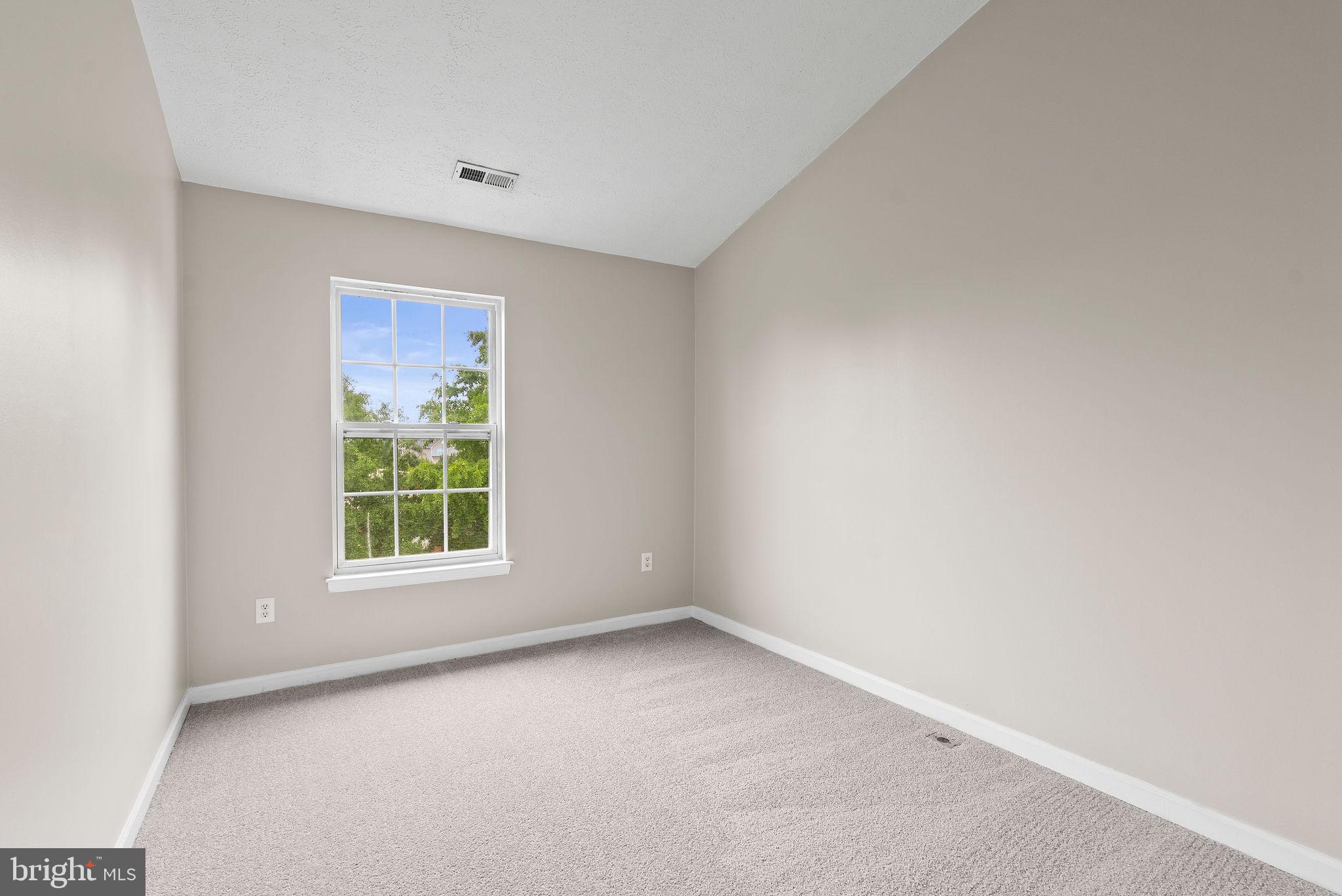 9711 Luguna Road Baltimore, MD 21220 - Photo 32 of 37 an empty room with a window