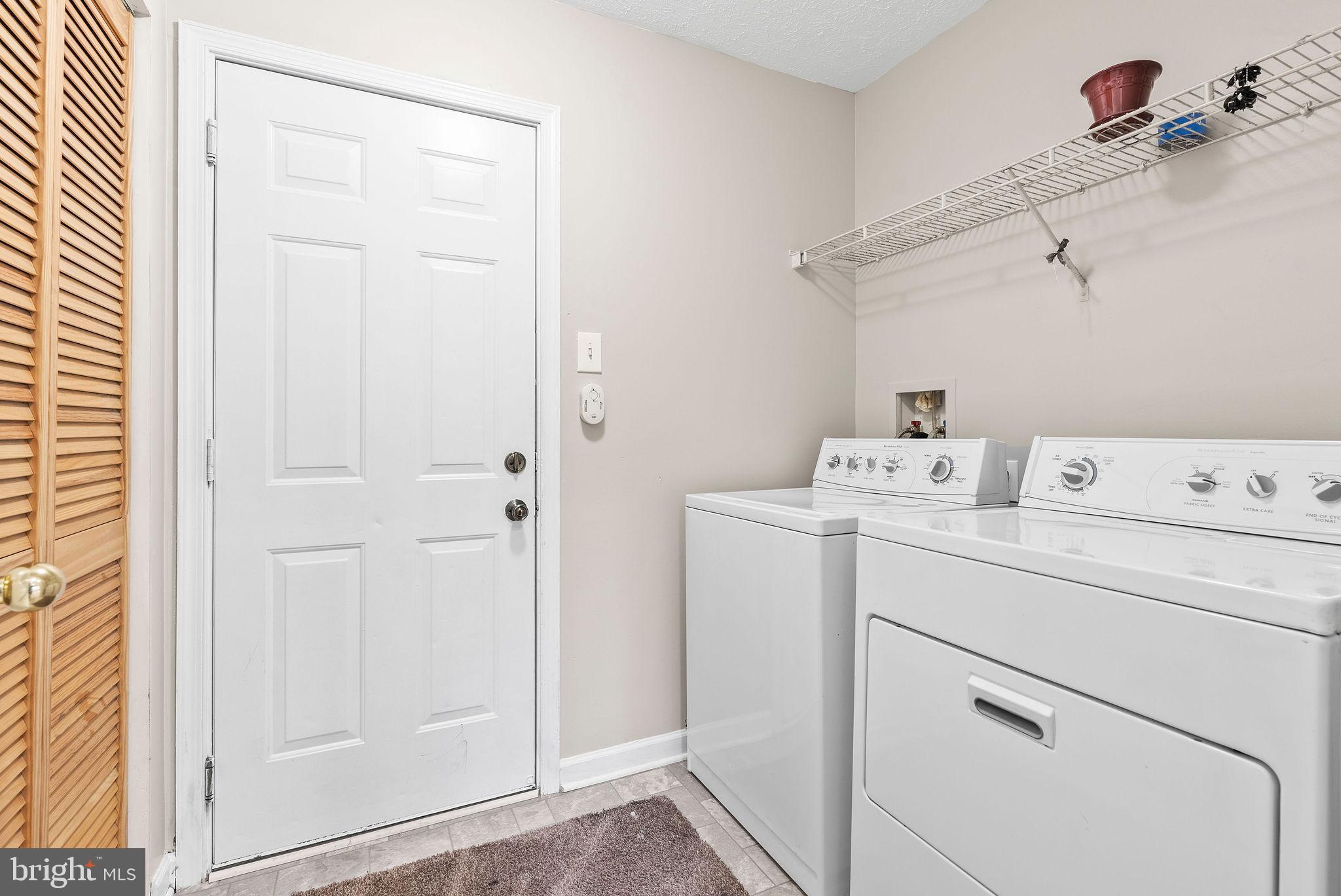 9711 Luguna Road Baltimore, MD 21220 - Photo 7 of 37 a utility room with dryer and washer