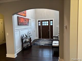 2500 Walnut View Drive Howell, MI 48855 - Photo 4 of 41 Entrance foyer featuring arched walkways and dark wood-style floors