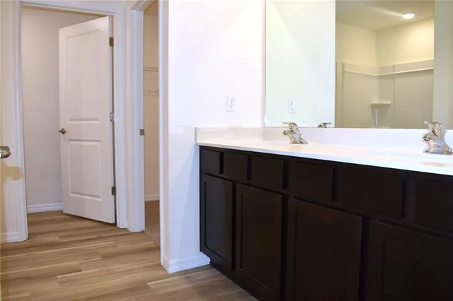 a bathroom with a sink and a mirror