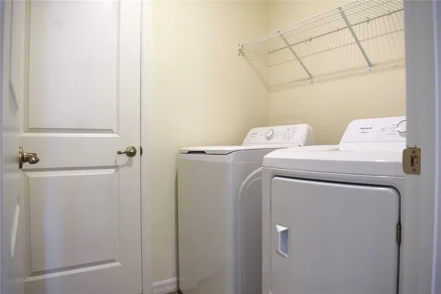 a utility room with dryer and washer