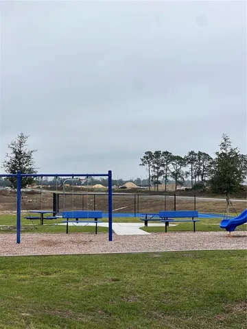 a view of a swimming pool with an outdoor seating