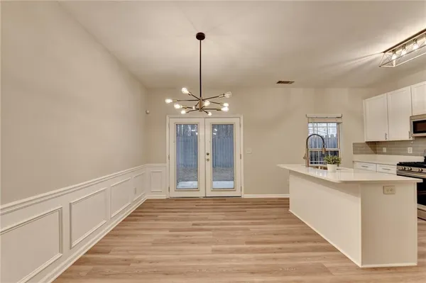 a view of a kitchen counter top space and wooden floor