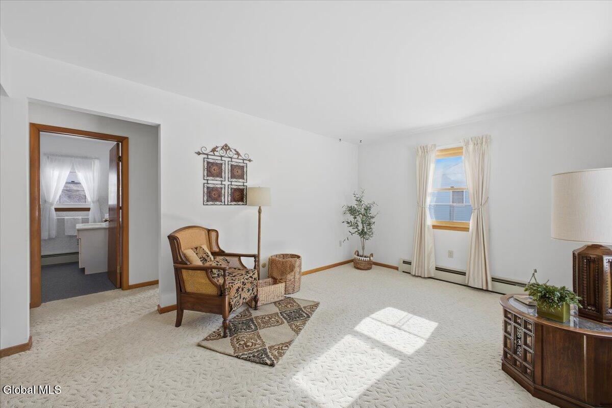 7132 Fuller Station Road Guilderland, NY 12303 - Photo 3 of 20 Living room with plush carpeting.