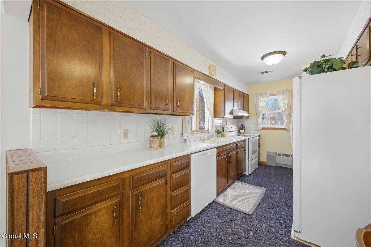 7132 Fuller Station Road Guilderland, NY 12303 - Photo 7 of 20 Plenty of durable wood cabinetry.