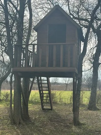 a view of an empty room with wooden door