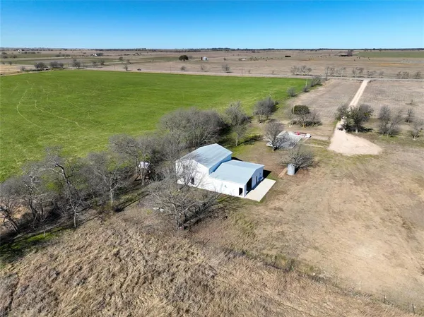 a view of a yard with an ocean view