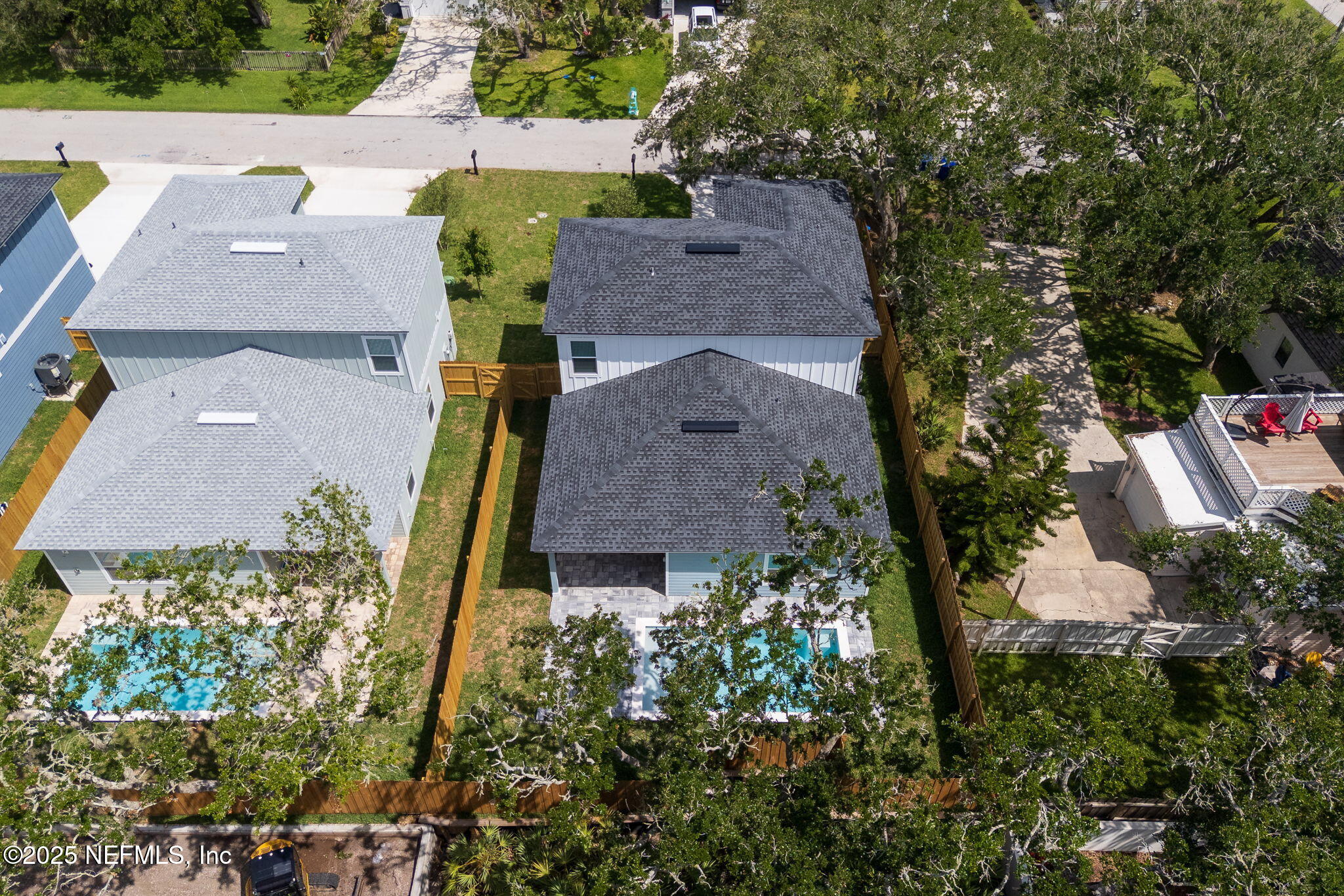 603 Twenty Second Street St. Augustine, FL 32084 - Photo 3 of 36 an aerial view of multiple houses with yard
