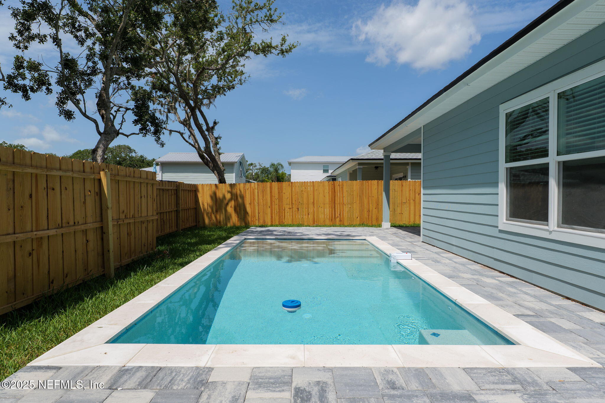 603 Twenty Second Street St. Augustine, FL 32084 - Photo 34 of 36 a backyard with a sink and wooden fence