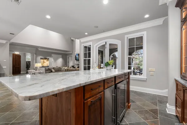 a spacious bathroom with a double vanity sink and a mirror