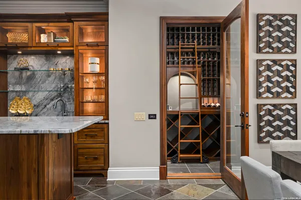a kitchen with refrigerator and window