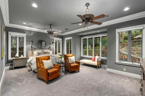 a bedroom with bed and window