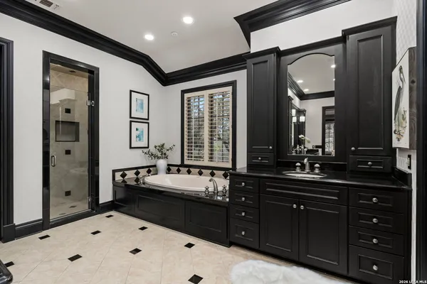a bathroom with a granite countertop sink a toilet and shower