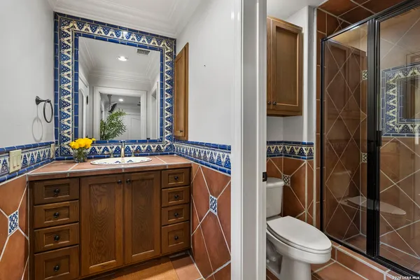 a front view of a house with garden and sitting area