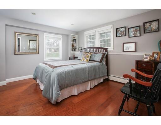21 Lawrence Lane Lexington, MA 02421 - Photo 11 of 18 a bedroom with a bed and wooden floor
