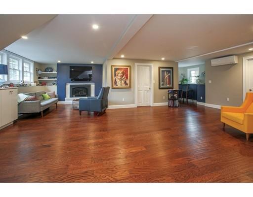21 Lawrence Lane Lexington, MA 02421 - Photo 13 of 18 a living room with furniture and a fireplace