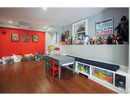 21 Lawrence Lane Lexington, MA 02421 - Photo 16 of 18 a room with furniture and a flat screen tv