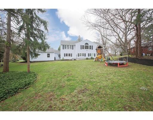 21 Lawrence Lane Lexington, MA 02421 - Photo 2 of 18 a view of a white house with a big yard and large trees