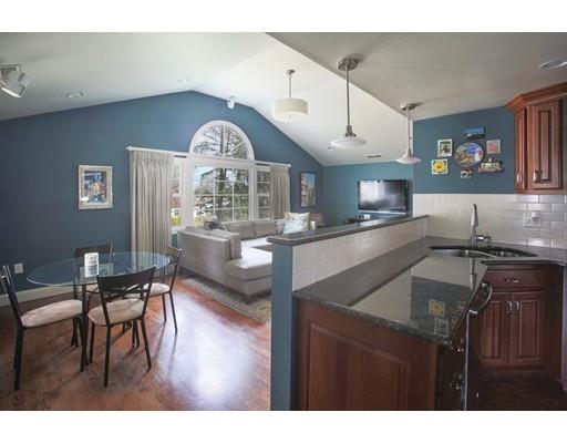 21 Lawrence Lane Lexington, MA 02421 - Photo 6 of 18 a kitchen with stainless steel appliances granite countertop a stove a sink dishwasher and cabinets with wooden floor