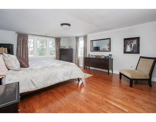 21 Lawrence Lane Lexington, MA 02421 - Photo 8 of 18 a bedroom with a bed and wooden floor