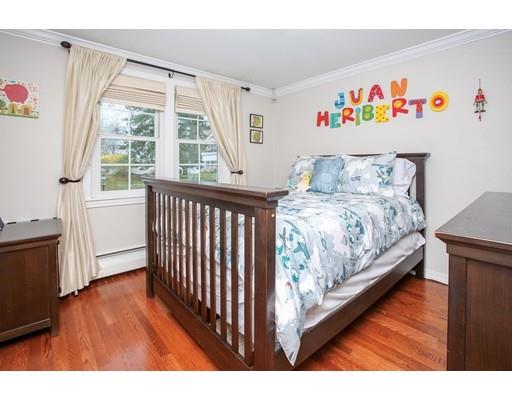 21 Lawrence Lane Lexington, MA 02421 - Photo 9 of 18 a bedroom with a bed and a large window