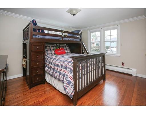 21 Lawrence Lane Lexington, MA 02421 - Photo 10 of 18 a bedroom with a bed and wooden floor