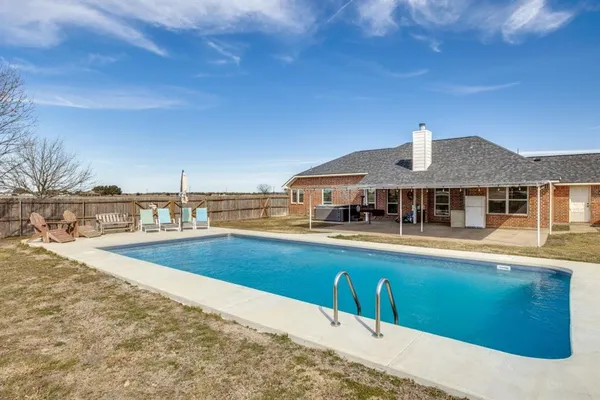 a front view of a house with swimming pool