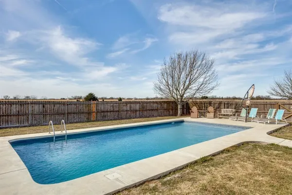 a view of a swimming pool with a terrace