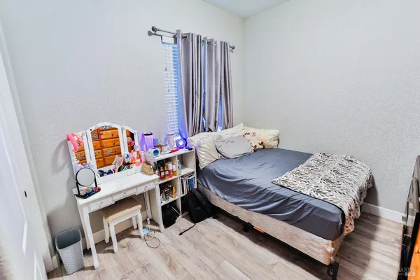 a bedroom with a bed and a window