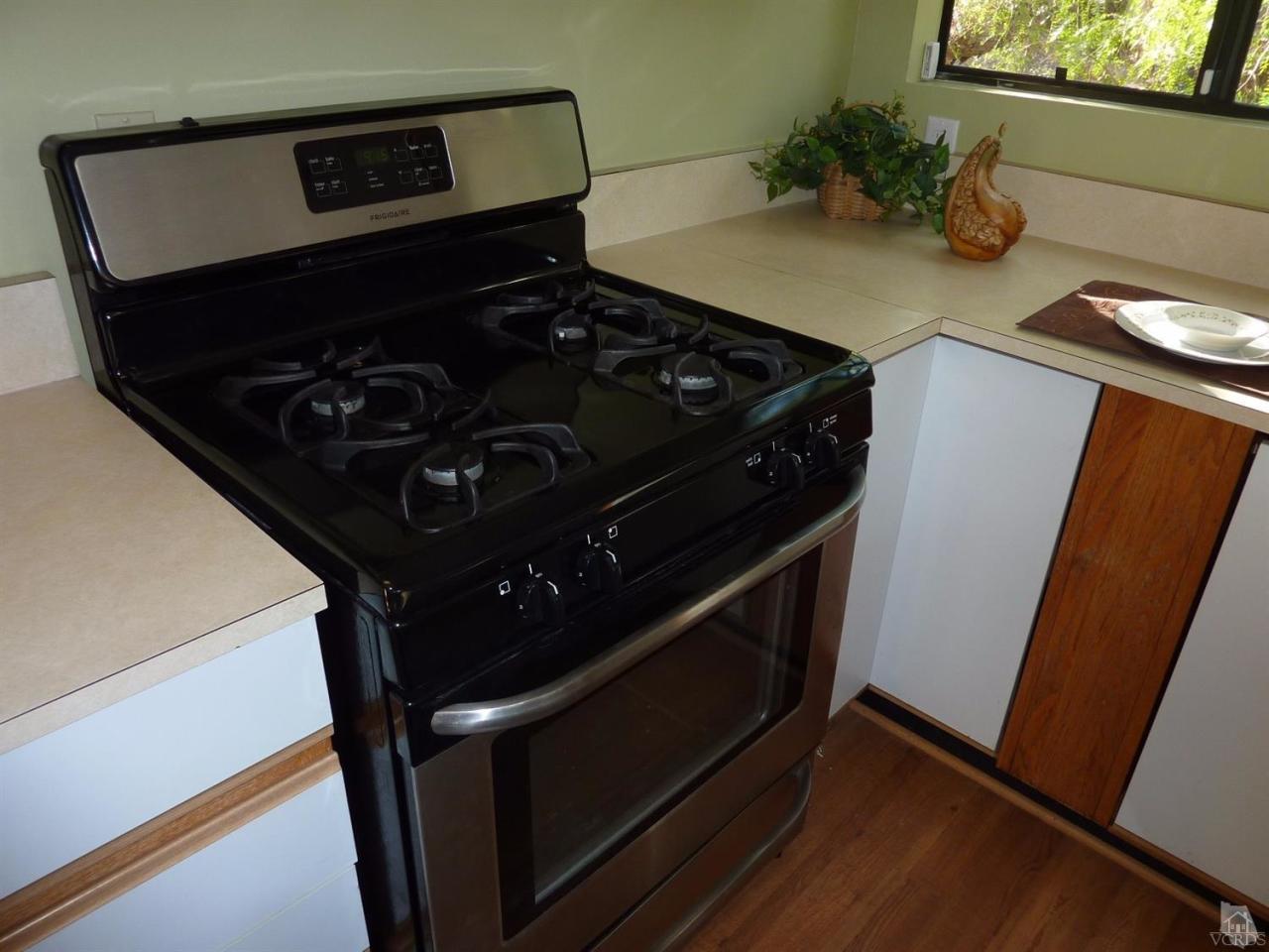 1040 Black Canyon Road Simi Valley, CA 93063 - Photo 14 of 33 a close view of a stove and a microwave