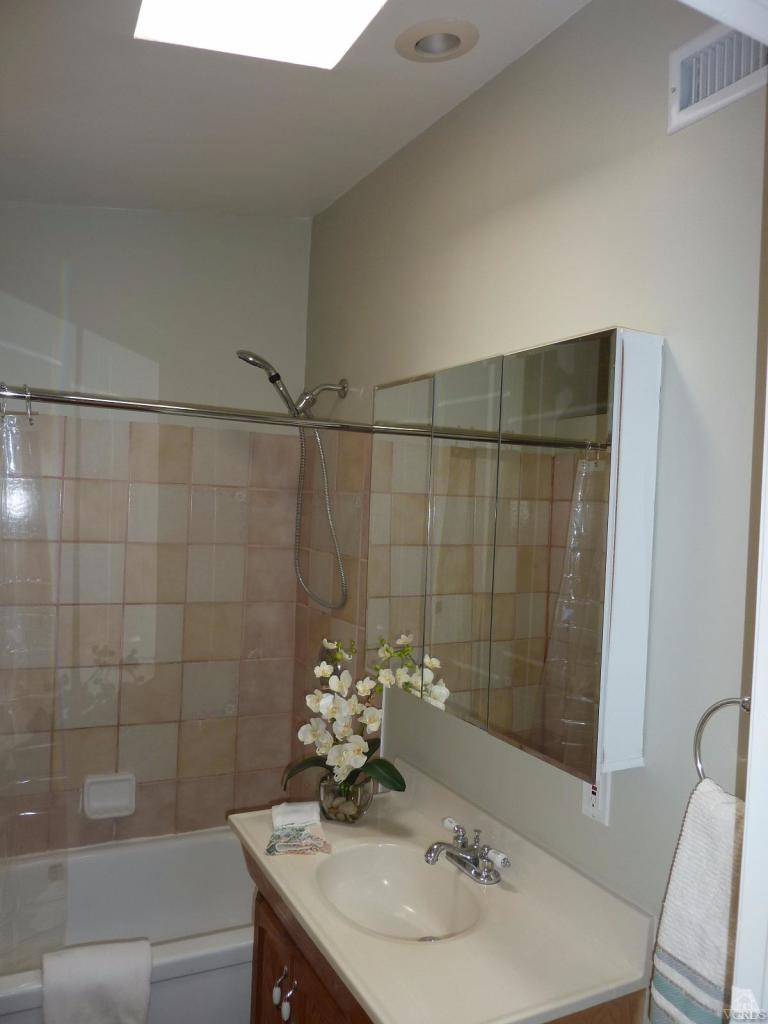 1040 Black Canyon Road Simi Valley, CA 93063 - Photo 22 of 33 a bathroom with a sink and shower