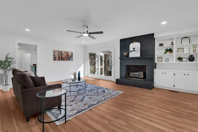 a living room with furniture and a fireplace