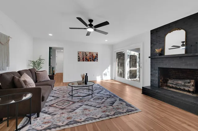 a living room with furniture and a fireplace