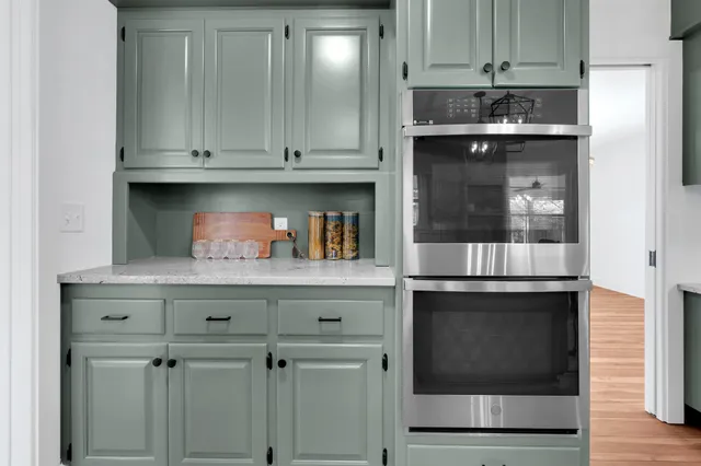 a kitchen with a sink counter top space and cabinets