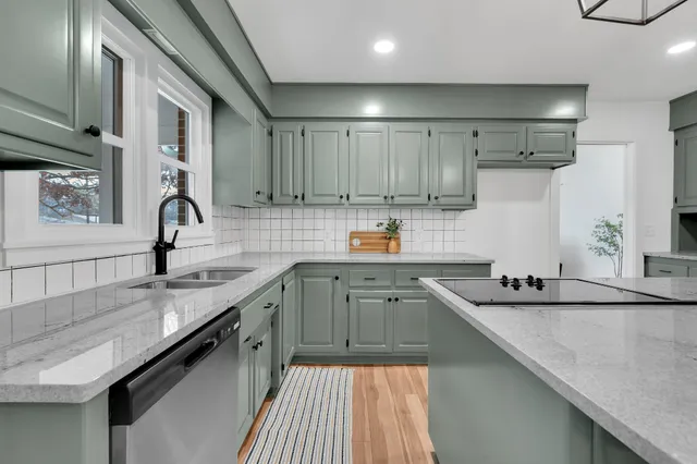 a dining room with furniture and chandelier
