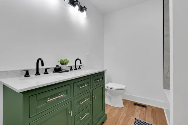 a bathroom with a sink and mirror