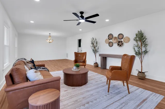 a living room with furniture and a chair