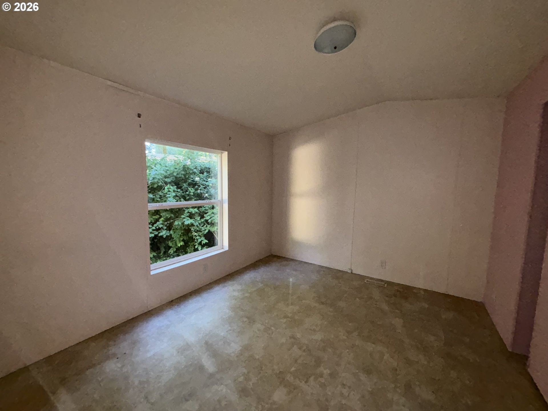 64 Outer Drive Florence, OR 97439 - Photo 5 of 8 an empty room with windows