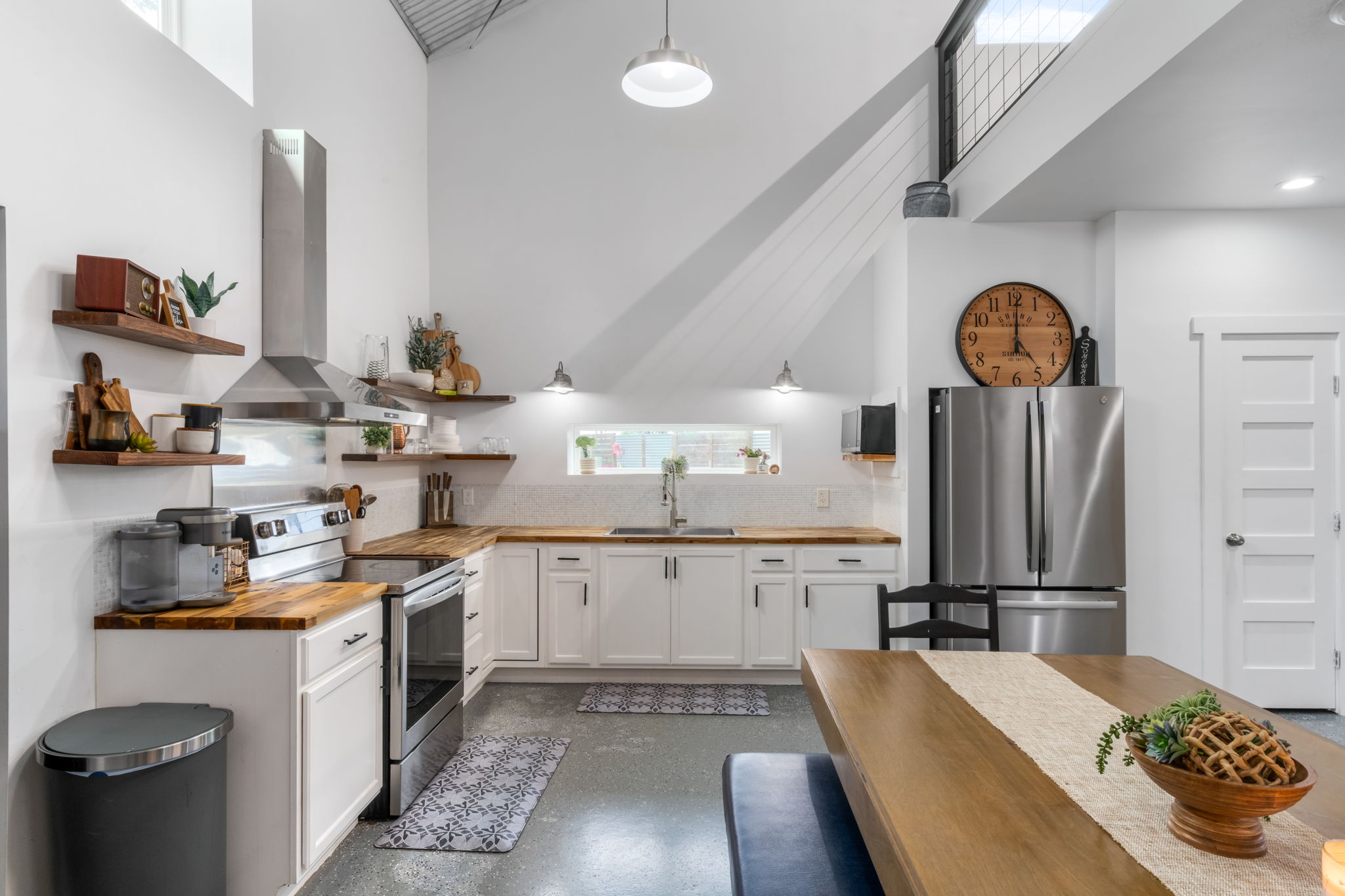 180 Henly Loop Dripping Springs, TX 78620 - Photo 13 of 38 a kitchen with a sink stove and cabinets